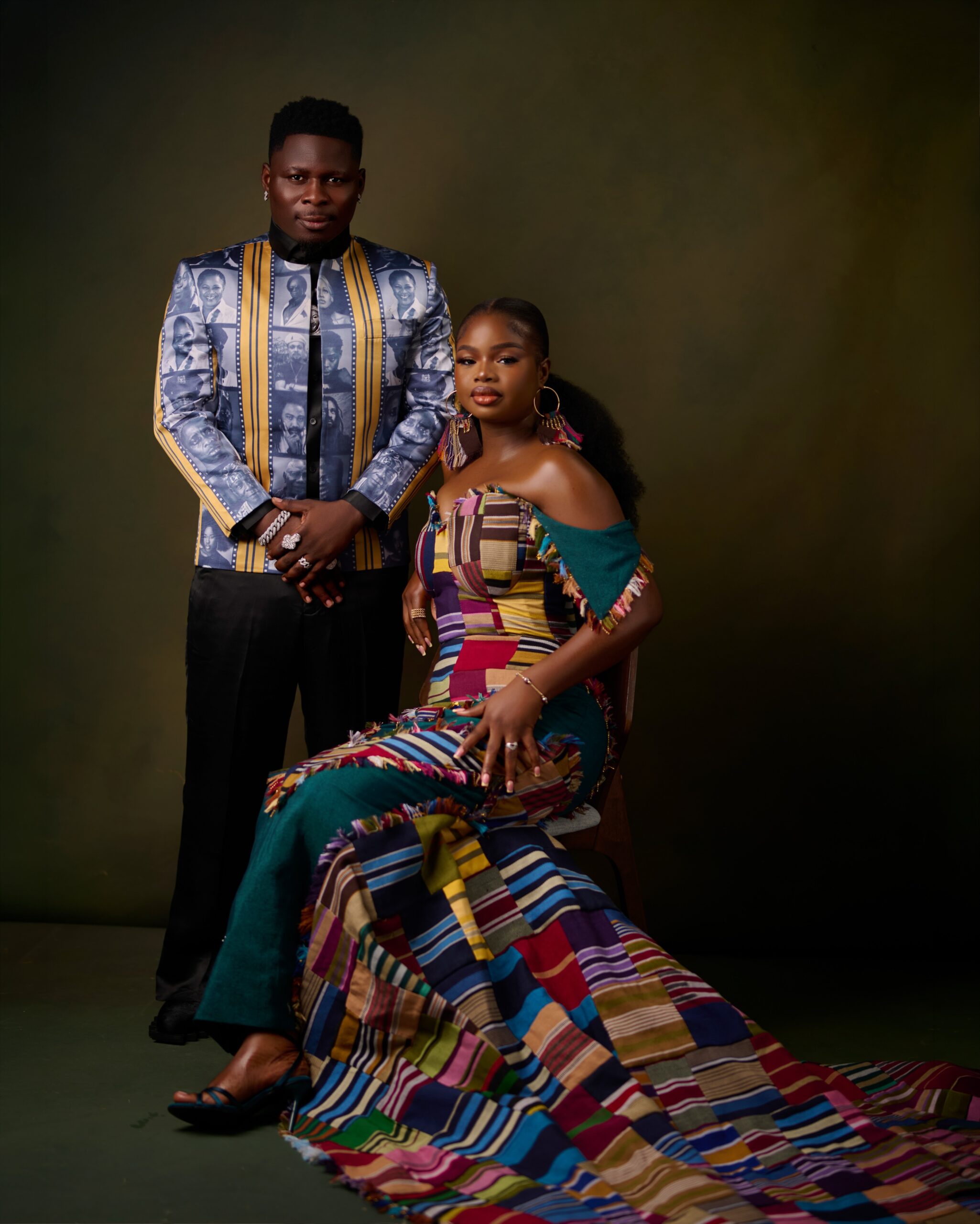 Akinyoola Ayoola (Kamo State) alongside his wife wearing a colourful patchwork strapless gown at the Starlomo movie premiere