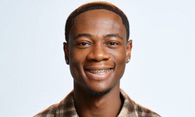 BBNaija Season 11 finalist Tram smiling in a brown patterned shirt