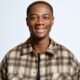 BBNaija Season 11 finalist Tram smiling in a brown patterned shirt