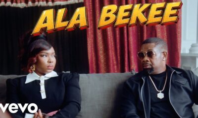 Yemi Alade and Don Jazzy sitting together on a lounge sofa under a bold yellow Ala Bekee title graphic.