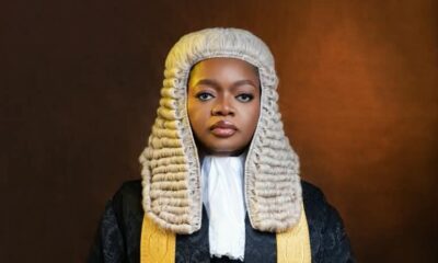 Olamide Mojigbotoluwa Ehinfun-Adekunle wearing the ceremonial Senior Advocate of Nigeria silk gown, gold lace trim, white collar, and full legal wig.