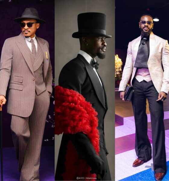 Shawn Faqua in a pinstripe suit, Larry Hector in a tailcoat with red boa, and Yemi Cregx in a blush jacquard jacket at BellaNaija red carpet.
