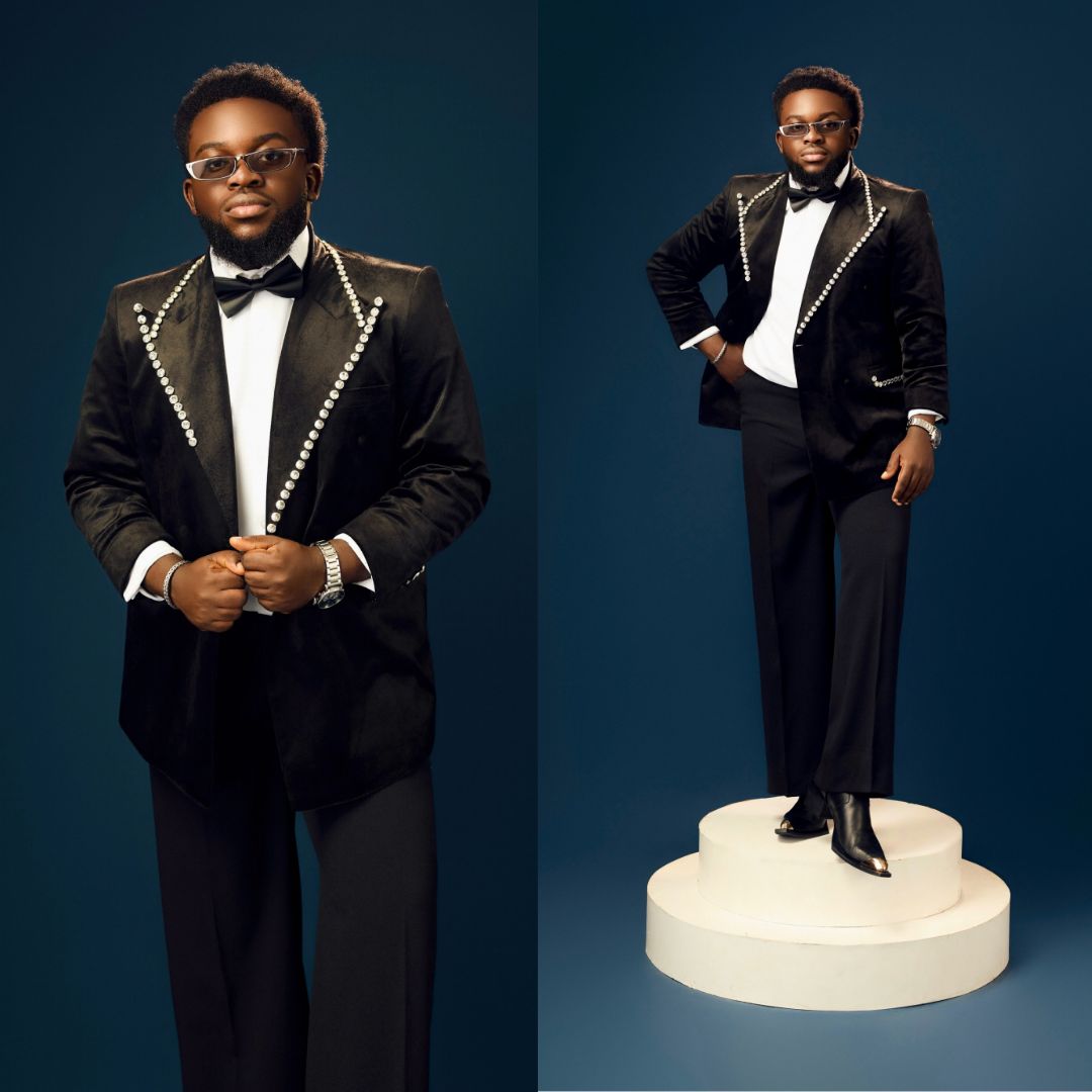 Folagade Banks in a black velvet tuxedo jacket with pearl trim along the lapels at BellaNaija 20th anniversary.