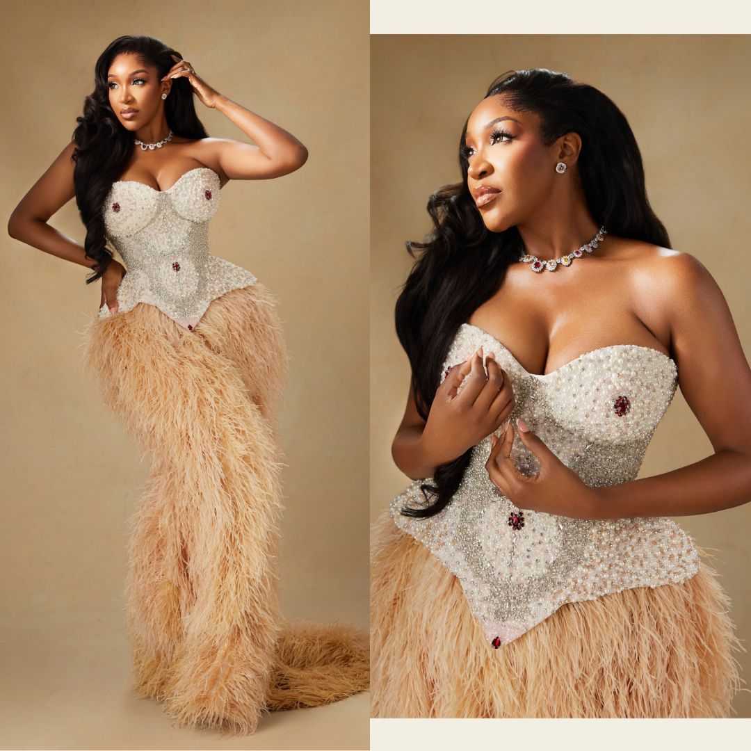 : Idia Aisien in pearl-embellished corseted gown with nude feather skirt at BellaNaija 20th Anniversary Grand Red Carpet Experience.