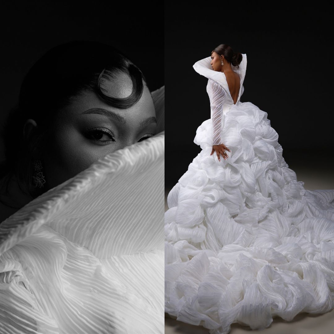 Mide Iwasokun wearing white sculptural gown with ruffled cascading train at BellaNaija 20th Anniversary Grand Red Carpet Experience.