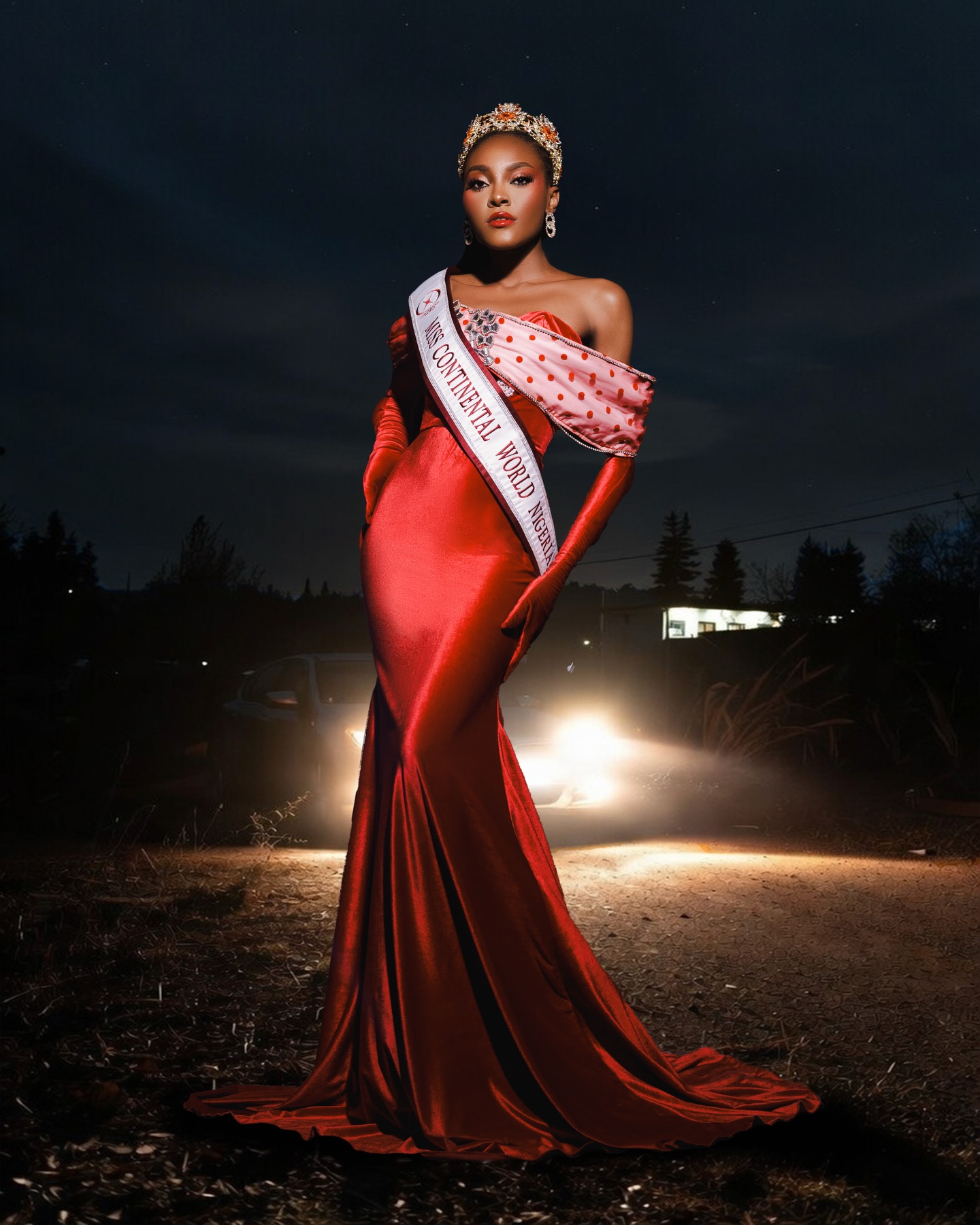 Osele Iruomachukwu wearing a red floor-length gown, crown, and Miss Continental World sash.