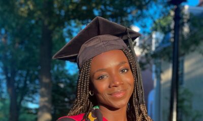 Nigerian-born engineer Yinka Ogunbiyi wearing a graduation gown, cap, and kente stole at Harvard.