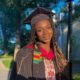 Nigerian-born engineer Yinka Ogunbiyi wearing a graduation gown, cap, and kente stole at Harvard.