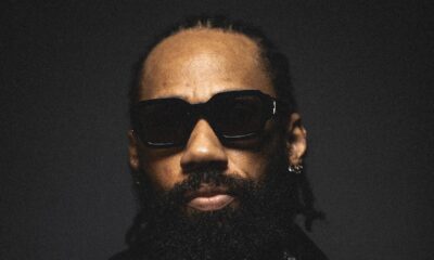 Nigerian rapper and singer Phyno wearing dark sunglasses, a leather jacket, and a diamond cross pendant, promoting his romantic highlife single Beautiful featuring a spoken intro by Nancy Isime from his album Let That Sink In (LTSI).