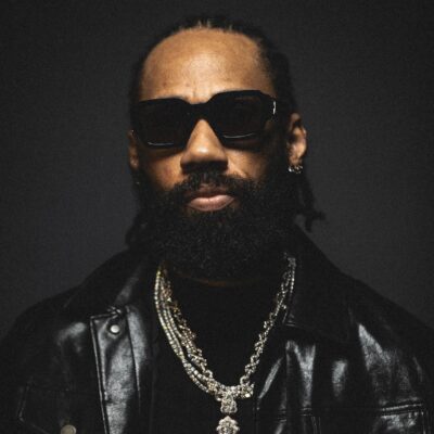 Nigerian rapper and singer Phyno wearing dark sunglasses, a leather jacket, and a diamond cross pendant, promoting his romantic highlife single Beautiful featuring a spoken intro by Nancy Isime from his album Let That Sink In (LTSI).