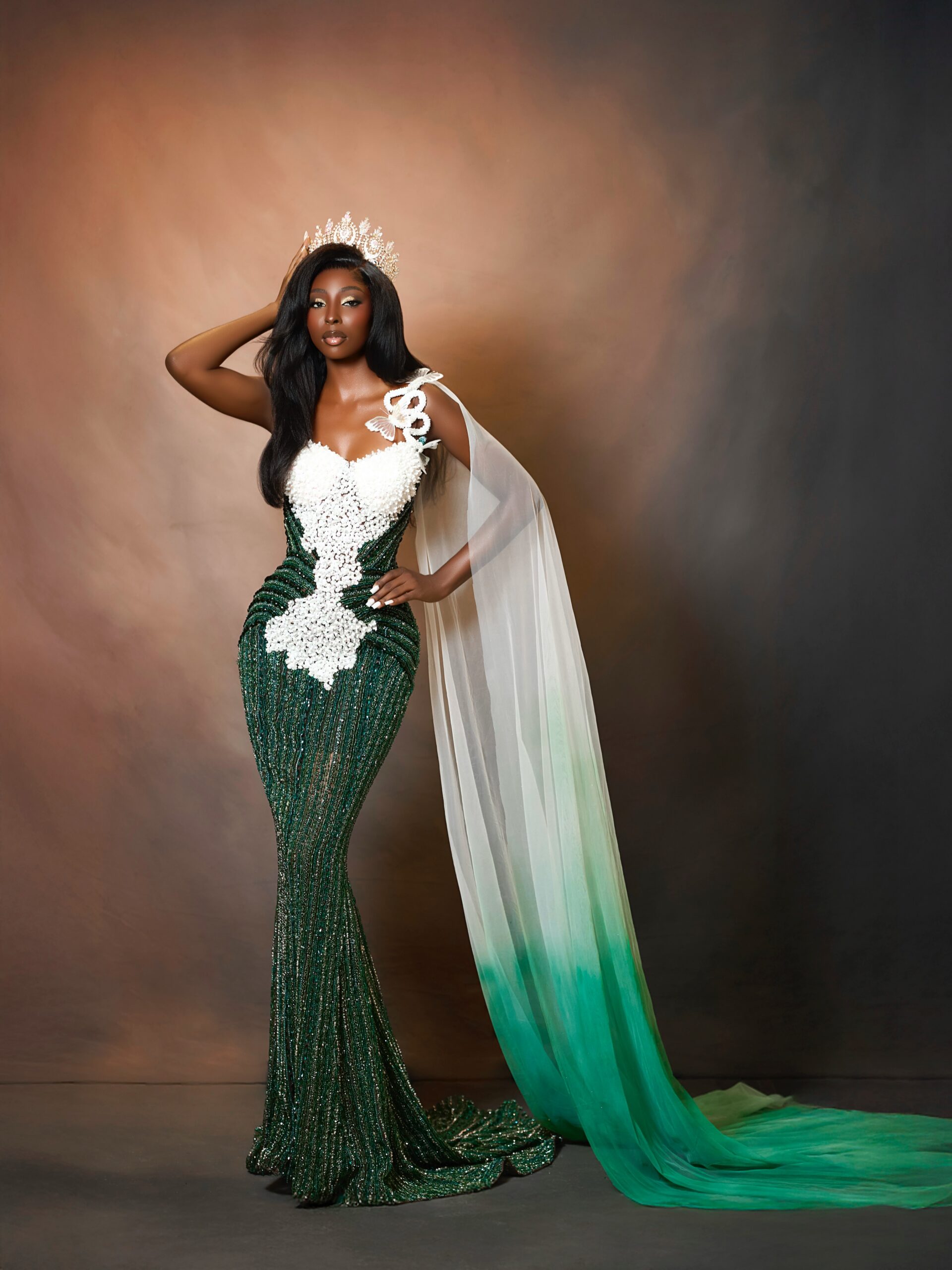 Tamunosoye Karibi-George wearing a green and white evening gown with a crown.