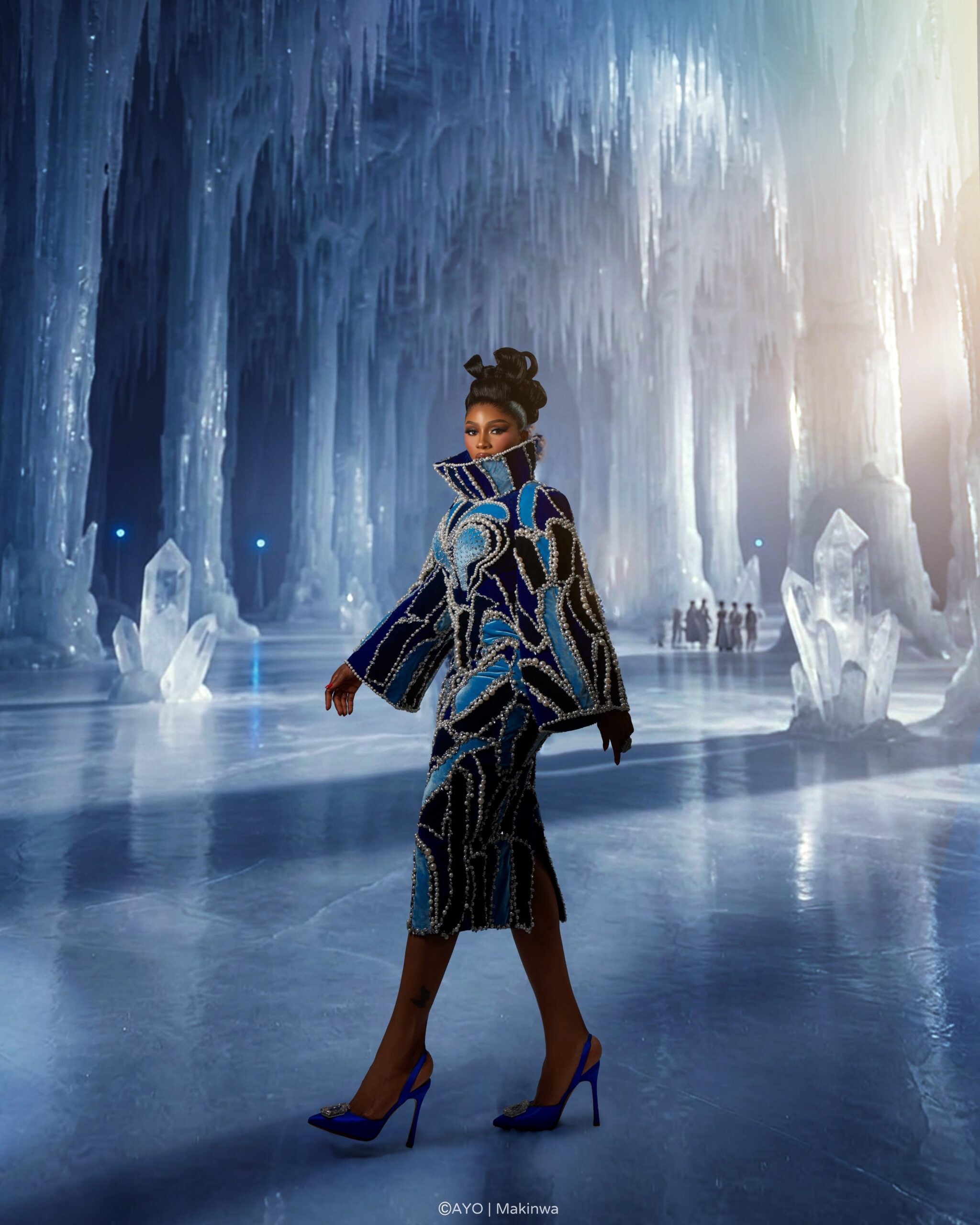 Mercy Eke walking in custom ice blue and black velvet Amy Aghomi gown for BellaNaija Grand Red Carpet Experience