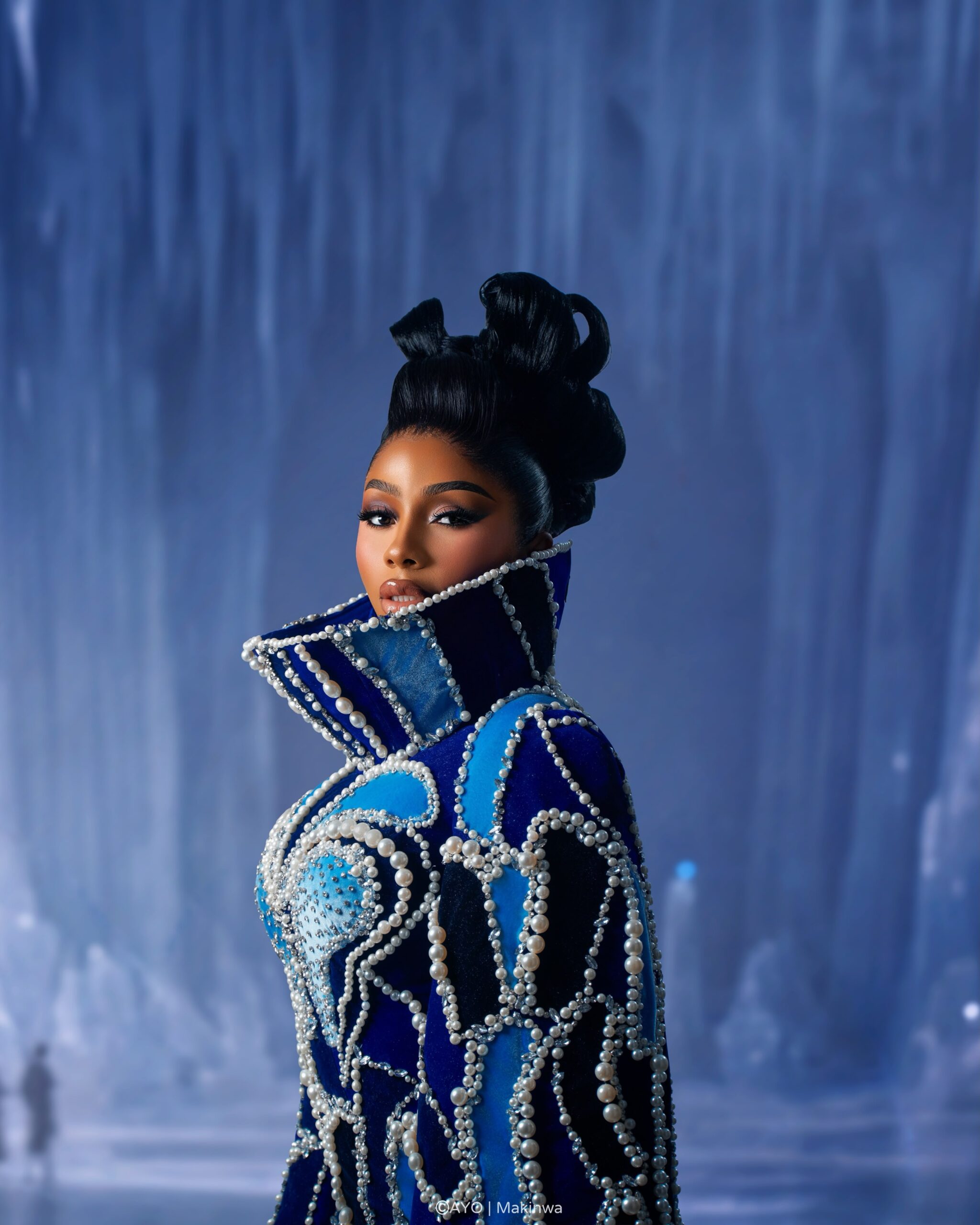 Mercy Eke wearing Amy Aghomi velvet dress and statement pearl ring for BellaNaija at 20