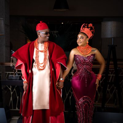 Timini Egbuson and Bimbo Ademoye smiling at each other in traditional Nigerian bridal wear