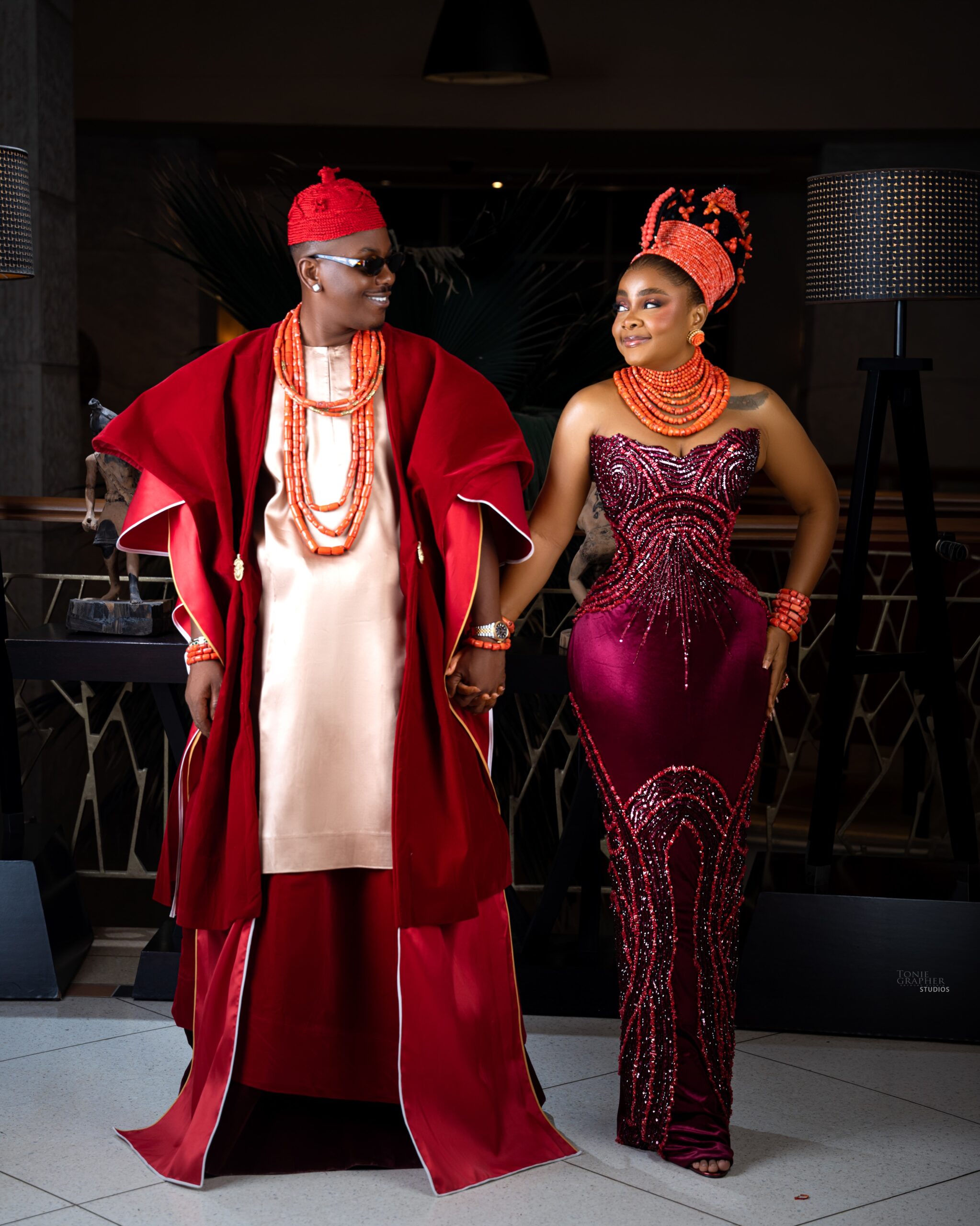Timini Egbuson and Bimbo Ademoye smiling at each other in traditional Nigerian bridal wear