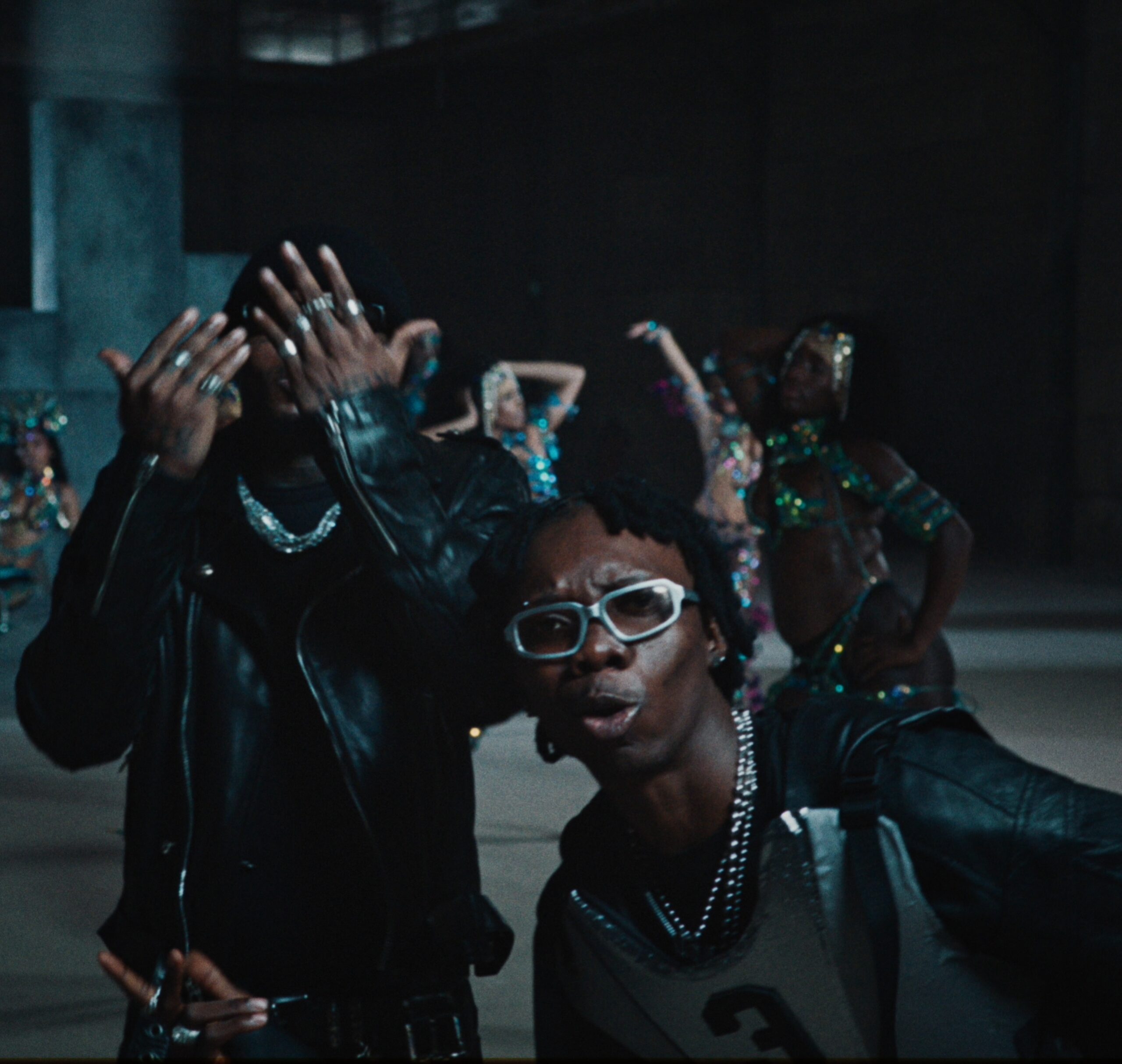 Blaqbonez and Asake wearing black leather jackets in the Ikebe 3000 music video.