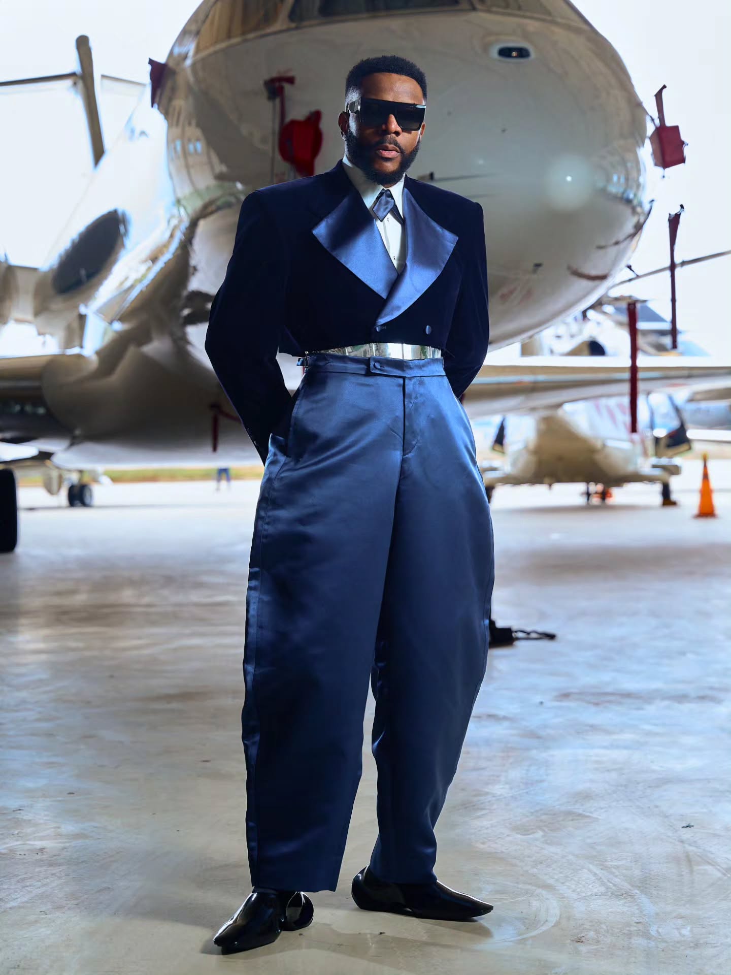 Ebuka Obi-Uchendu wearing a Mai Atafo navy cropped velvet tuxedo and slate blue satin trousers for Big Brother Naija Season 11 finale.