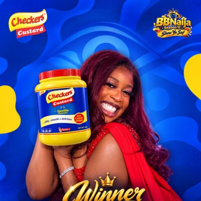 BBNaija Season 11 winner Temi Nkem holding a 2kg jar of Checkers Custard Vanilla Flavour against a blue background.