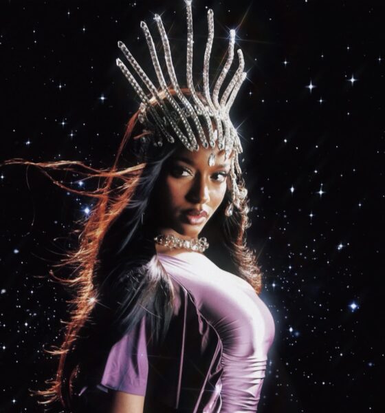 Nigerian singer Ayra Starr wearing a metallic purple dress and a jeweled crown headpiece against a starry night background for her Starrgirl album and tour promo.