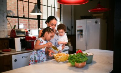 Mother and children preparing food in a bright, cosy kitchen setting. Credit: RDNE Stock Project/Pexels.